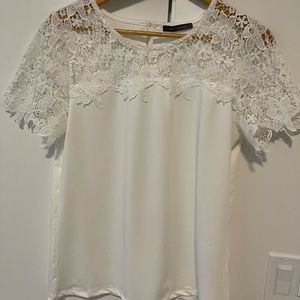Suzy Shier cute white top with pattern detail. Brand New size medium